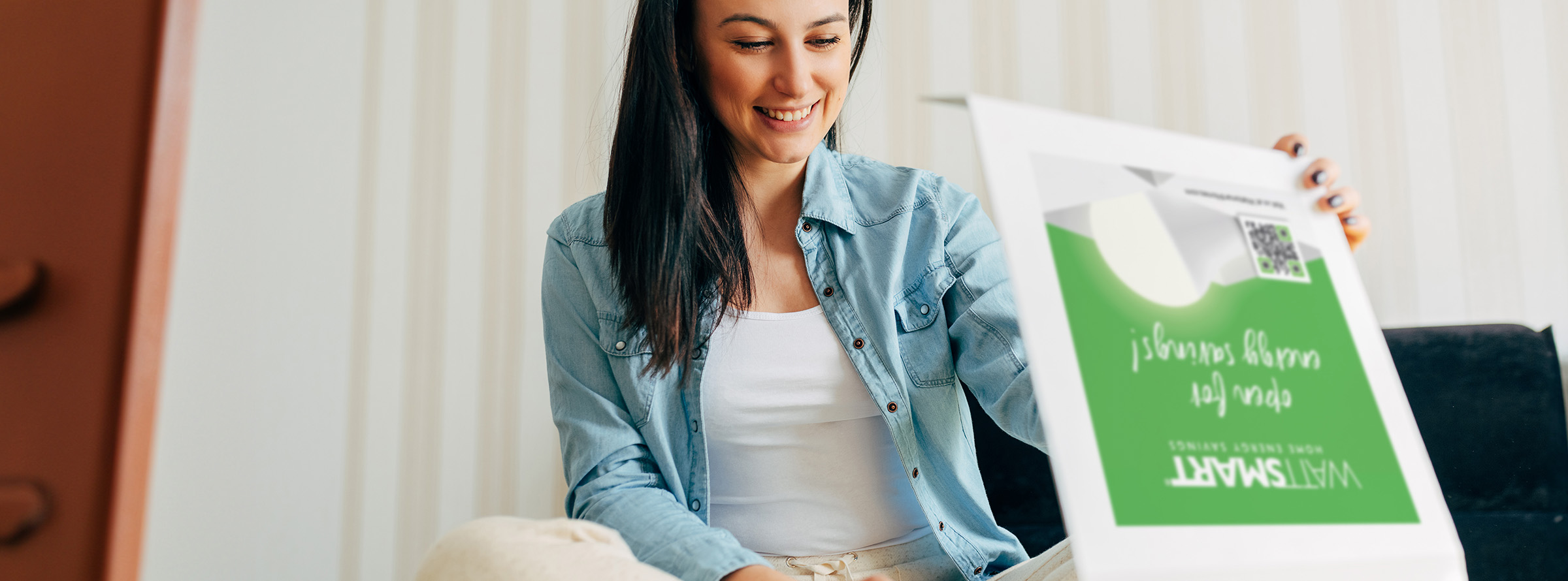 Woman reviewes her HEA box from Wattsmart Homes